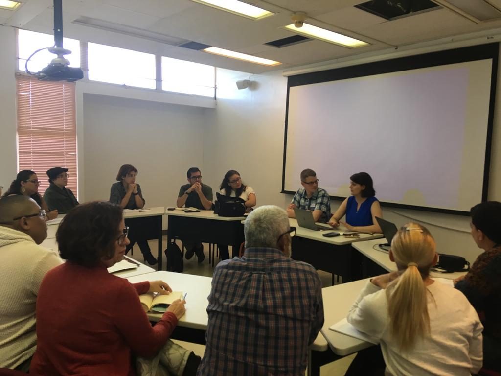 Photo of audience and presenters Christina Boyles and Andrew Petersen at their conference "Digital Humanities and Hurricane María" at UPR-Río Piedras (2019)