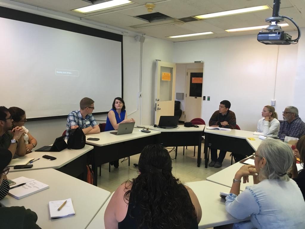 Photo of presenters Christina Boyles and Andrew Petersen answering audience questions at their conference "Digital Humanities and Hurricane María" at UPR-Río Piedras (2019)